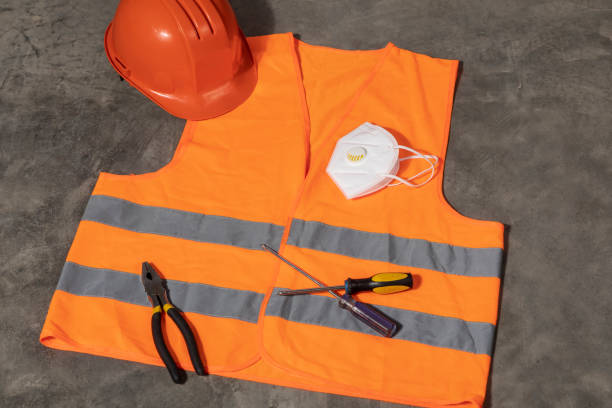new normality. Dayscene of a construction site uniform and tools on the floor before somebody takes it during COVID-19 pandemic.