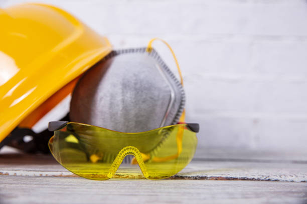 During all construction works, we should not only wear appropriate personal protective equipment but also need common sense and proper thinking. He is dressed in work clothes and a helmet and is equipped with accessories necessary for every painter.