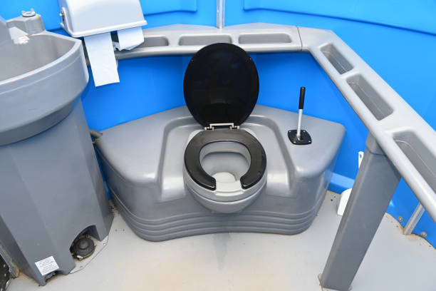Inside view of a portable plastic chemical toilet and wash basin