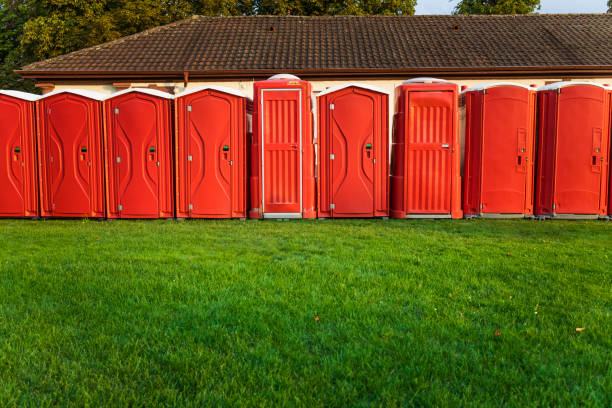 Portable plastic red toilets in a park - mobile sanitary system